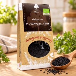 Czarnuszka ekologiczna Dary Natury 50 g – opakowanie i czarne nasiona czarnuszki na drewnianej łyżce
