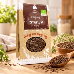 Kminek ziarno EKO 60g Dary Natury – opakowanie i przyprawa na drewnianym blacie