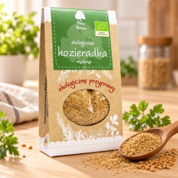 Kozieradka mielona EKO 60g Dary Natury – opakowanie i przyprawa na drewnianym blacie