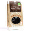 Organic black peppercorns in a jar – a classic seasoning for meats and sauces.